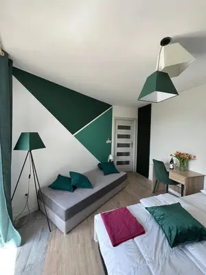 a kitchen with a table and chairs and a counter at Lust&Desire BDSM Krakow Apartment in Kraków