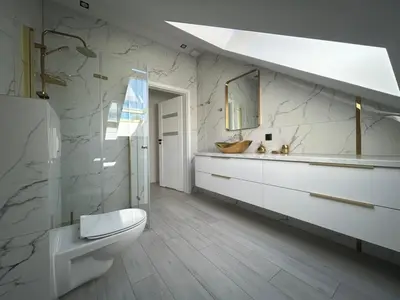 a bathroom with a toilet and a sink at Villa Kraków 2 in Kraków