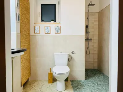 a bathroom with a toilet and a shower at Dom Parkowy in Kraków