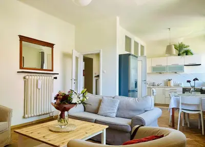 a living room with a couch and a table at Dom Parkowy in Kraków