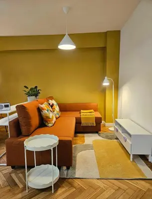 a living room with a couch and a table at Lovely Sparkly Apartment in Kraków