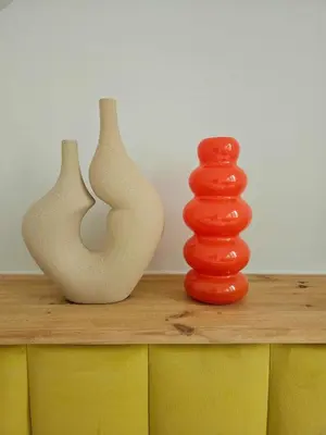 three vases sitting on top of a wooden table at Lovely Sparkly Apartment in Kraków