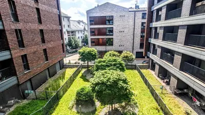 an aerial view of a courtyard between two buildings at Kaszmir Sky Apartment by Vistula River in Kraków
