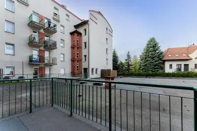 a view from the balcony of a building with a swimming pool at Konecznego Urban Escape Studio by BookingHost in Kraków