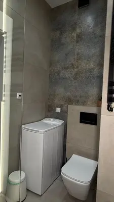 a small bathroom with a toilet and a sink at B37 Kazimierz Apartment in Kraków