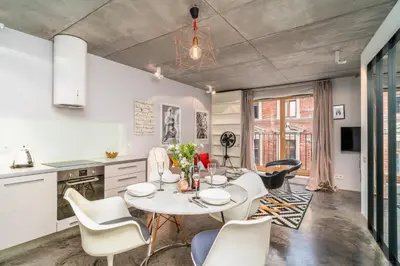 a kitchen and dining room with a table and chairs at Krakow Old Town - 47m2, Top location - by Rentujemy in Kraków