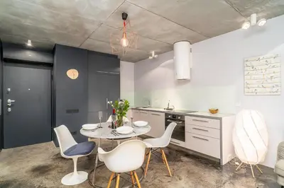 a kitchen and dining room with a table and chairs at Krakow Old Town - 47m2, Top location - by Rentujemy in Kraków