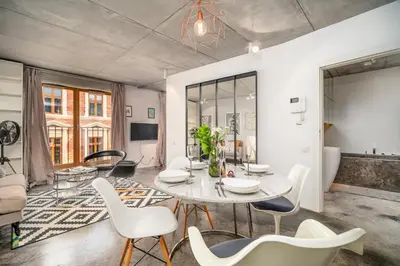 a living room with a table and chairs at Krakow Old Town - 47m2, Top location - by Rentujemy in Kraków