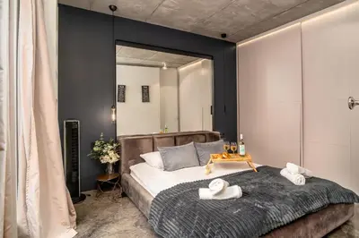 a bedroom with a large bed with towels on it at Krakow Old Town - 47m2, Top location - by Rentujemy in Kraków