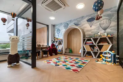 a childs room with a mural of hot air balloons at Wings Plaza in Kraków