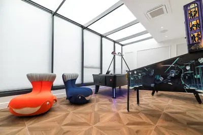 a room with two play equipment and a piano at Wings Plaza in Kraków