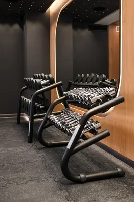 two chairs in a dressing room with a mirror at Wings Plaza in Kraków