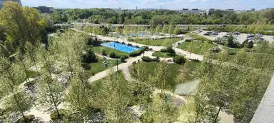 an overhead view of a park with a swimming pool at Apartment Orlińskiego in Kraków