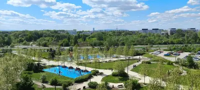 an aerial view of a pool in a park at Apartment Orlińskiego in Kraków