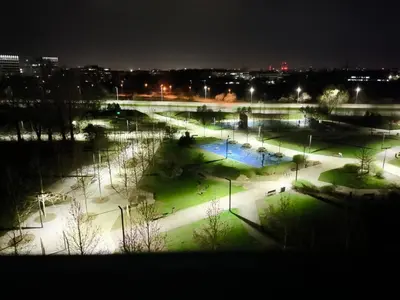a view of a park at night with lights at Apartment Orlińskiego in Kraków