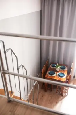 a table with two plates on it in a room at Loretas Roses Apartment Krakow Old Town in Kraków