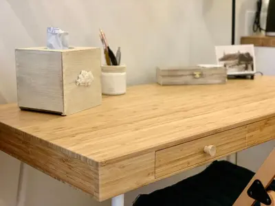 a wooden desk with two boxes on top of it at Next to Main Station in Kraków