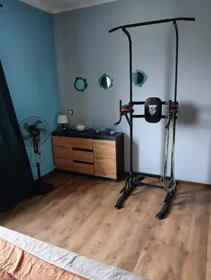 a bedroom with a room with a camera and a bed at Apartament Szóstka nad Sołą in Czaniec