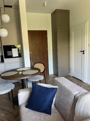 a living room with a couch and a table at Nowoczesny apartament w Makowie Podhalańskim in Maków Podhalański