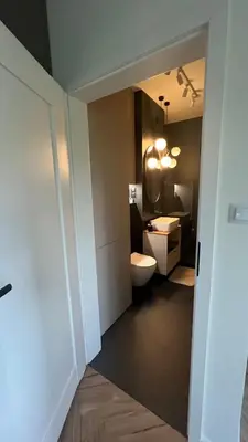 a bathroom with a toilet and a sink at Nowoczesny apartament w Makowie Podhalańskim in Maków Podhalański