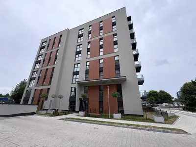 a largeartment building with a building at Apartamenty na Pana Tadeusza in Kraków