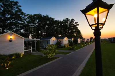 a street light in front of a row of houses at Skandynawia Przystań & Family Resort in Zator