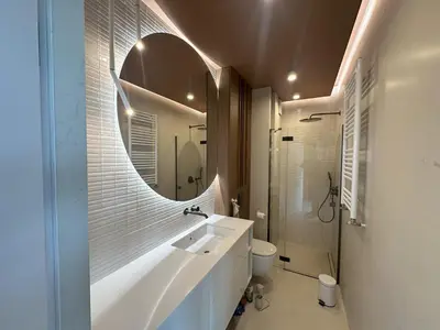 a bathroom with a sink and a mirror at Aga Apartments Cracow Old Town in Kraków