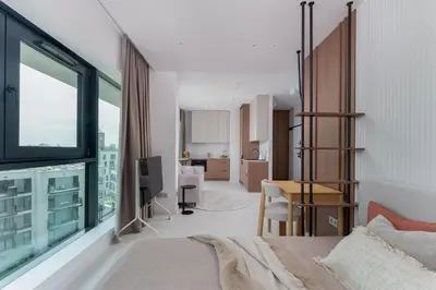 a bedroom with a bed and a desk in a room at Aga Apartments Cracow Old Town in Kraków