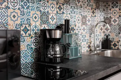 a coffee maker sitting on a counter in a kitchen at Monika Apartments by Upstairs in Kraków