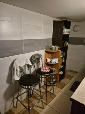 two chairs and a table in a kitchen at Pokoj u Eleni #2 in Kraków