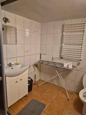 a small bathroom with a sink and a toilet at Pokoj u Eleni #3 in Kraków