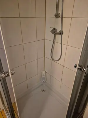 a bathroom with a shower with a tub at Pokoj u Eleni #3 in Kraków