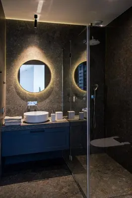 a bathroom with a sink and a mirror at Tyzenhauz Apartments Superior in Kraków