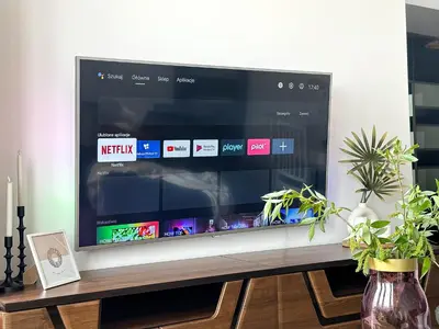 a flat screen tv sitting on top of a table at Vista Kraków Ugorek in Kraków