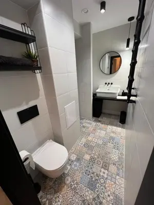 a bathroom with a toilet and a sink at CracoviaStay Lofty Apartment Old Town Kazimierz Historic Heart of Krakow in Kraków