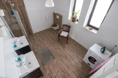 an overhead view of a bathroom with two sinks and a shower at Spacious house in the rural suburbs of Krakow in Zagacie