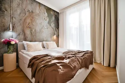 a bedroom with a large bed in front of a window at Jasmine Grand 7 by Housine in Zator