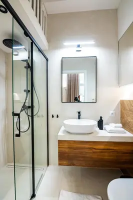 a bathroom with a sink and a mirror at PAUL-IN-SKY Apartment Krakow in Kraków