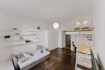 a living room with a couch and a bunk bed at Traugutta Loft in Kraków