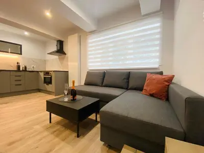 a living room with a couch and a table at Rzeszowska 5 Apt 02 in Kraków