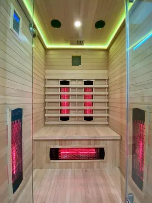 a sauna with a red light in the middle at Rzeszowska 5 Apt 02 in Kraków