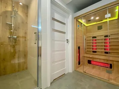 a bathroom with a shower and a glass shower stall at Rzeszowska 5 Apt 02 in Kraków