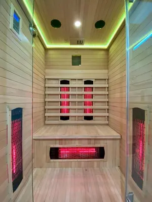 a sauna with a red light in the middle at Rzeszowska 5 Apt 02 in Kraków