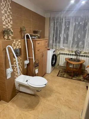 a bathroom with a toilet and a sink at Noclegi u Zosi in Staniątki