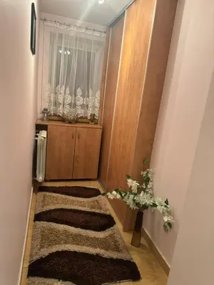 a small hallway with fur carpeting and a window at Noclegi u Zosi in Staniątki