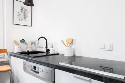 a kitchen with a sink and a counter top at Quiet Quarter - by Upstairs in Kraków