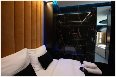 a room with a bed with a mirror and a window at Jacuzzi Glass-House Rakowicka 20 Central Station in Kraków