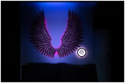 a purple phoenix with a clock in a room at Jacuzzi Glass-House Rakowicka 20 Central Station in Kraków