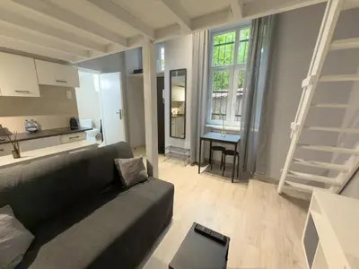 a bathroom with a shower and a sink and a toilet at Apartament z Antresolą i Prywatnym Patio in Kraków