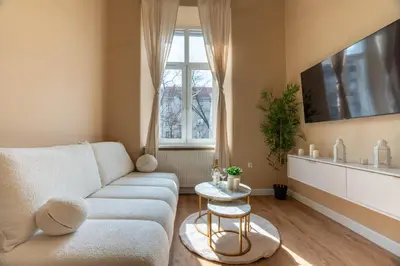 a living room with a sink and a living room with stairs at Apartament z Antresolą i Prywatnym Patio in Kraków